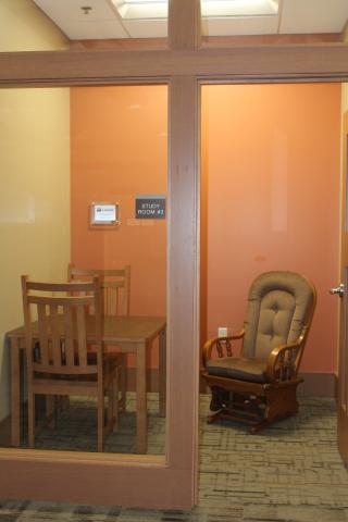 Small room with no exterior windows. Includes small table, 2 chairs, and rocking chair. Privacy shades are installed in this room.